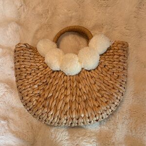 Woven Straw Hobo Bag with Cream Pom-Pom Accent